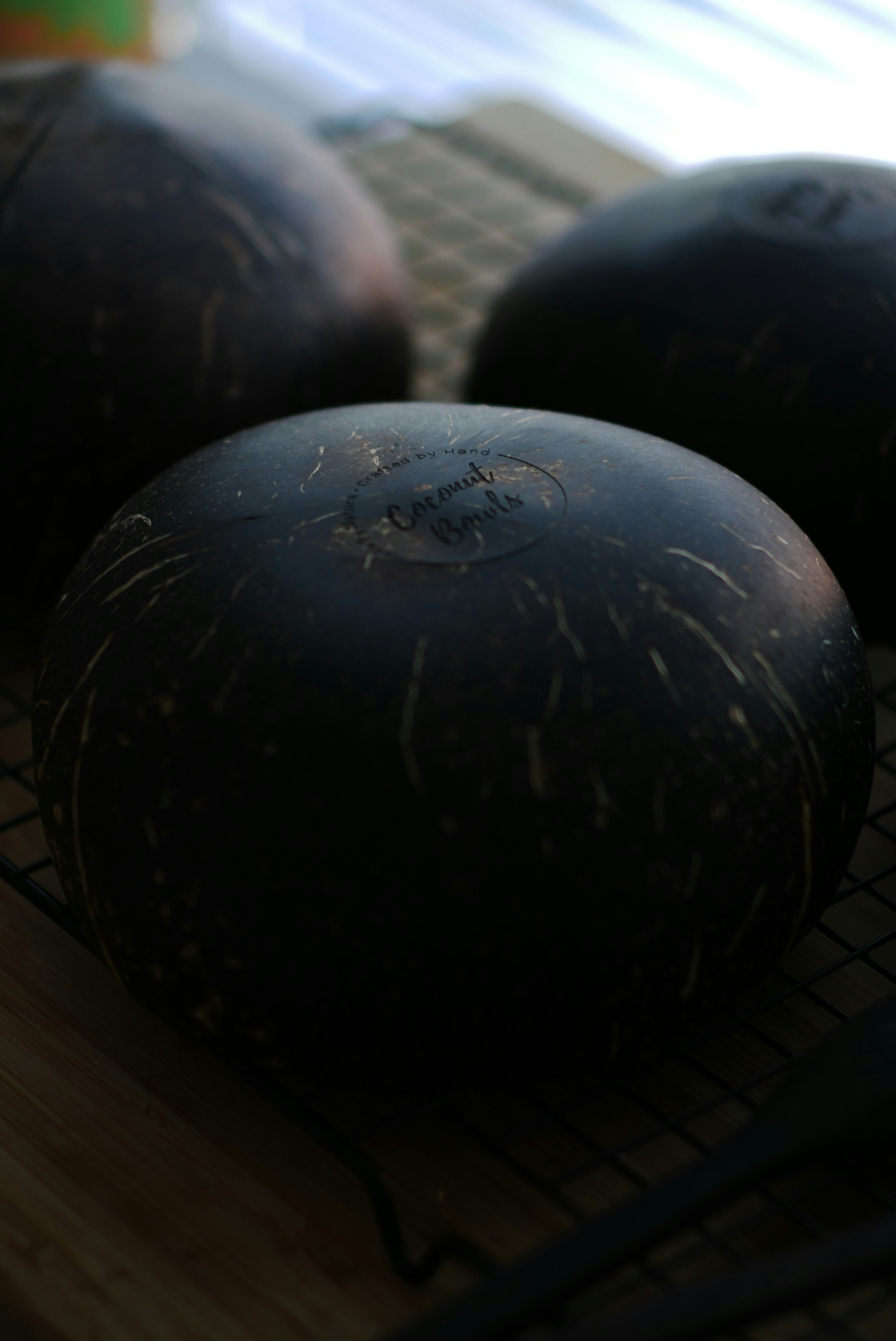 black round ball on brown wooden table